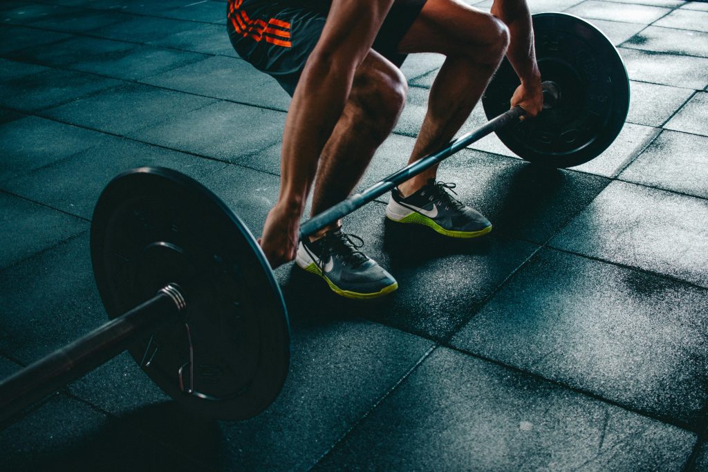 pexels photo 841130 841130 Man performing a deadlift exercise in a gym, demonstrating strength and fitness.